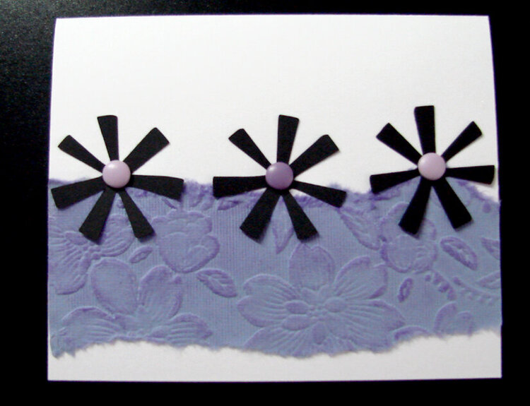 White card with black flowers and purple paper