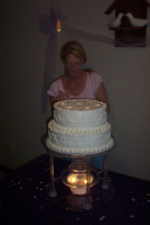 Me decorating a wedding cake
