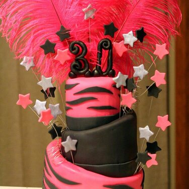 Pink feather topsy turvy cake