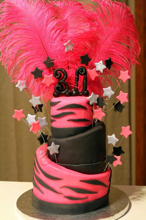 Pink feather topsy turvy cake