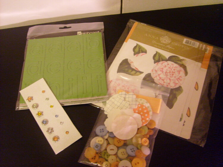 Flowers, buttons,chipboard and Gems!!