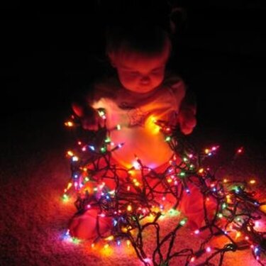 Julia and Christmas lights - 1 year