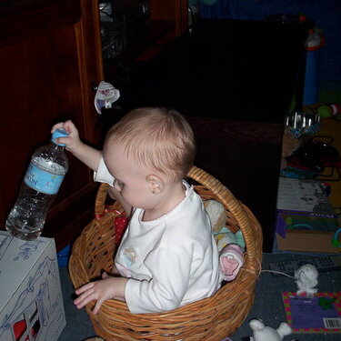 Elise playing IN her toy basket
