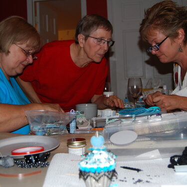 mom, aunt, and cousin - Cousin teaching us hw to make cupcakes