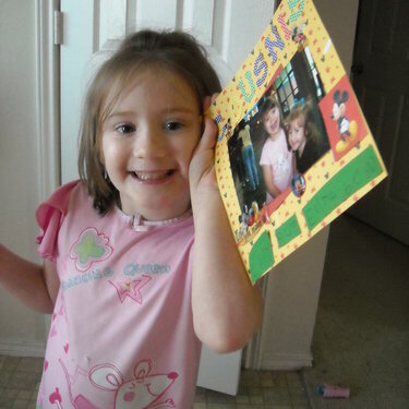 Elizabeth proudly displaying her finished page