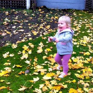 playing in autumn leaves