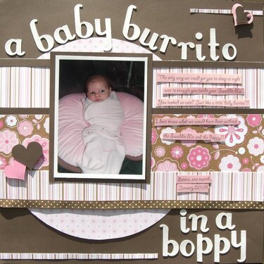a baby burrito in a boppy