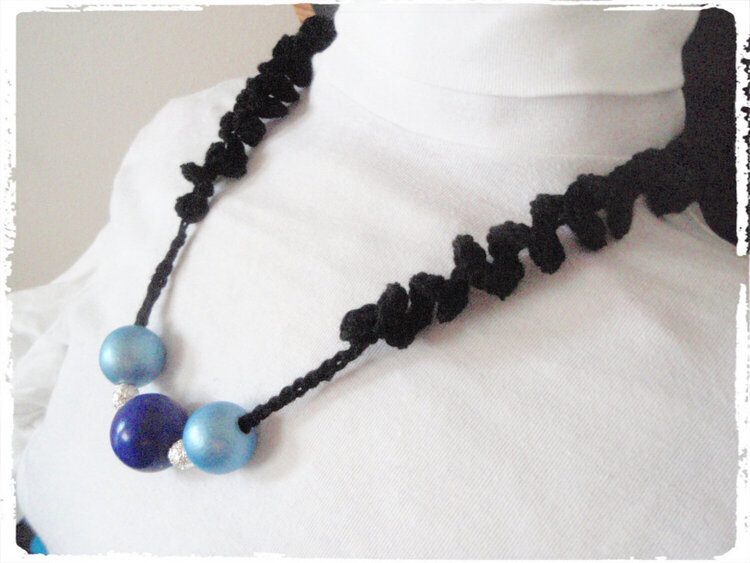 blue  necklace crocheted with twisted straps