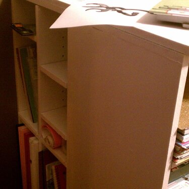 The side of my desk storage behind my paper storage!