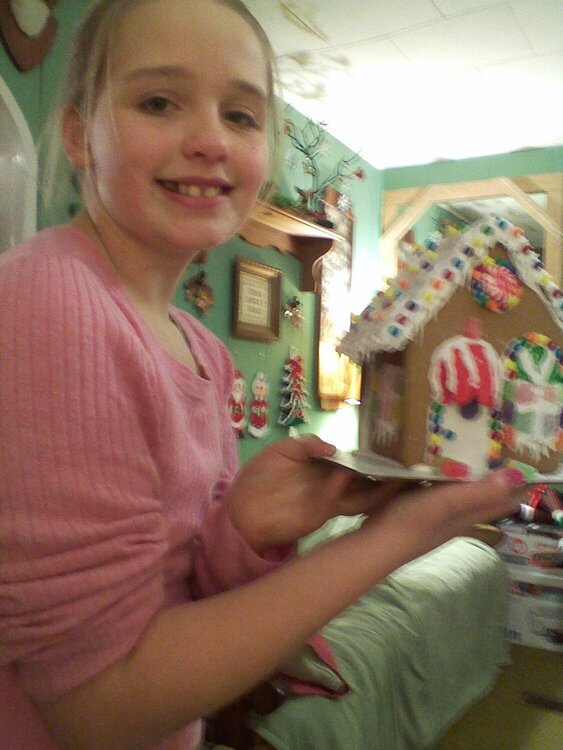 Grandaughter Nicole with her Gingerbread House