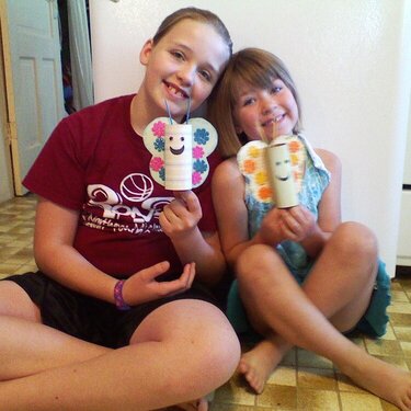 Grandaughters with butterfies that they made.