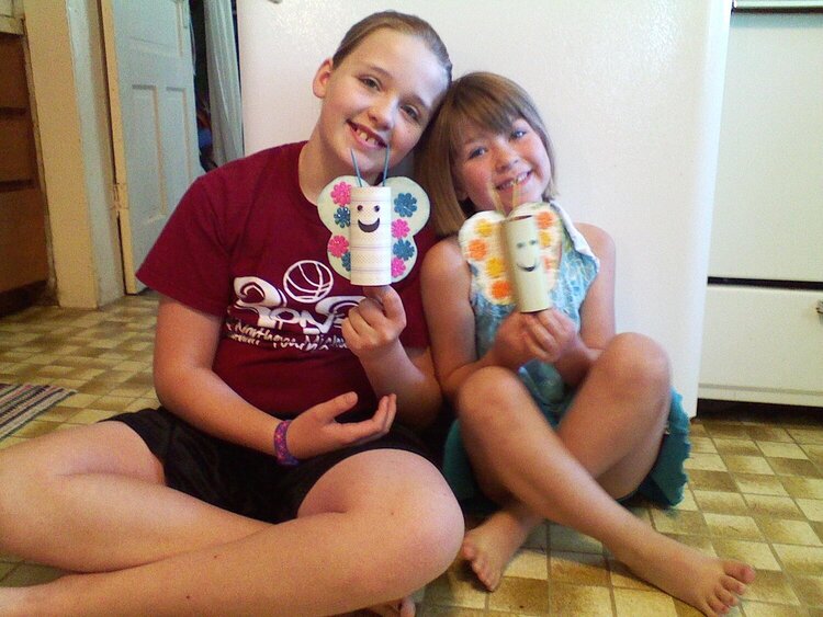 Grandaughters with butterfies that they made.