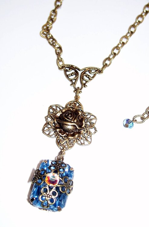 Nostalgic Blue Topaz wrapped Necklace