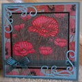 Red poppies on pewter with poppy paper