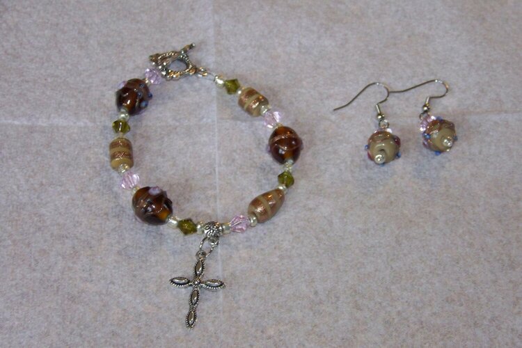 brown , green and pink bracelet and earrings