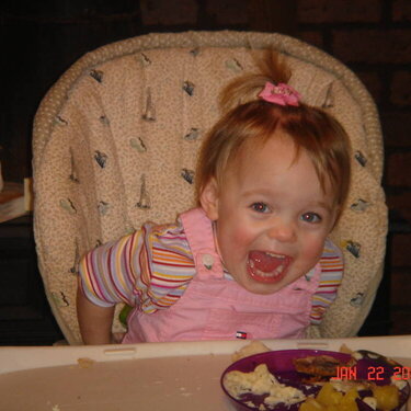 Kayley playing in the high chair