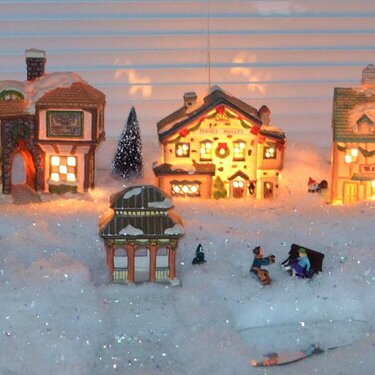 Winter Village in my dining room bay window. flash on