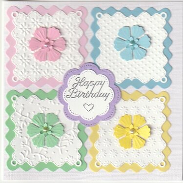 4 scalloped squares with flowers