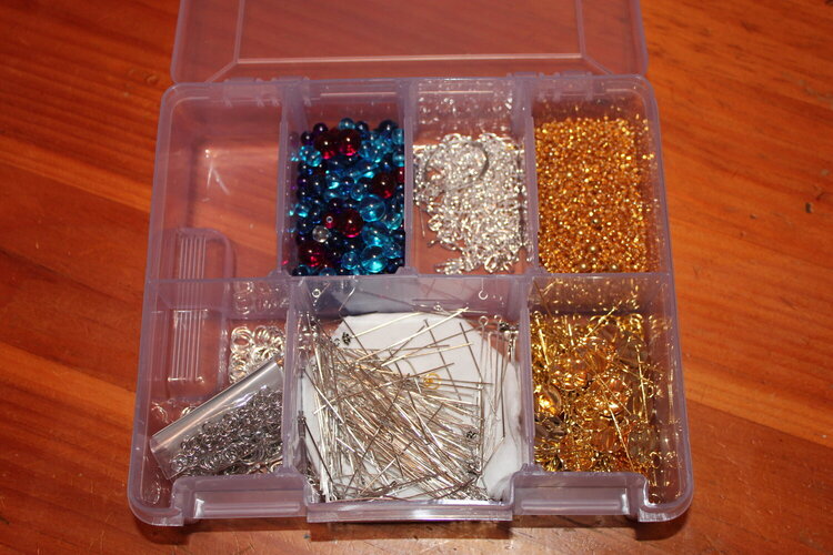 Findings Box, (#1, but ,my #2 one is only like 2 inches wide, I keep it next me while working and it has 6 spaces like 1/2 inch 