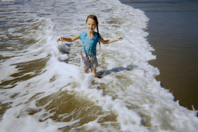 cadee playing in the waves