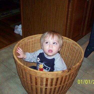 noah in the laundry basket