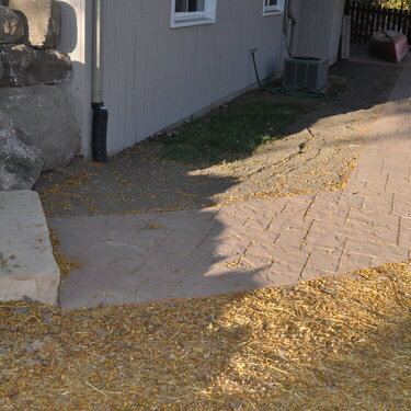 finished up sidewalk to walkout patio door, will fill in area up by house with small plants or bushes.