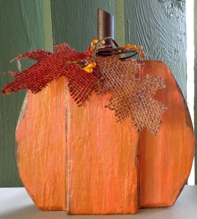 Painted wooden pumpkin w/ burlap leaves