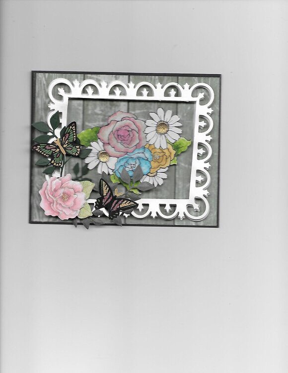 Framed Roses.  I saw a card on Scrapbook.com by Caletts and I though I would try doing a similar one myself.  Her card was so pr