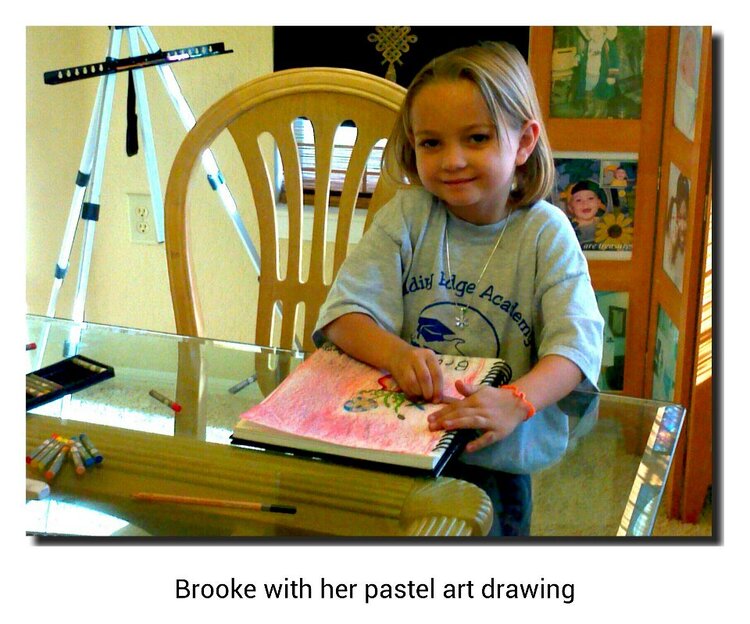 Brooke with her pastel art drawing after art lessons from her Opa