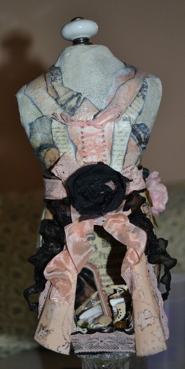 back of paper mache dress form