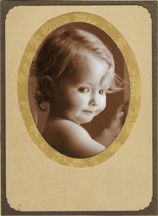 Child&#039;s face in oval - sepia