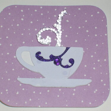 Close up of purple tea cup twinchie