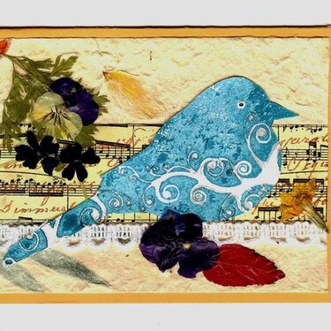 Pressed flowers and bird