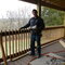 DH at the deck railing