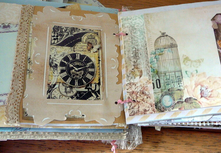 big photomat,with clock,and the other page a birdcage,in my big mini-book