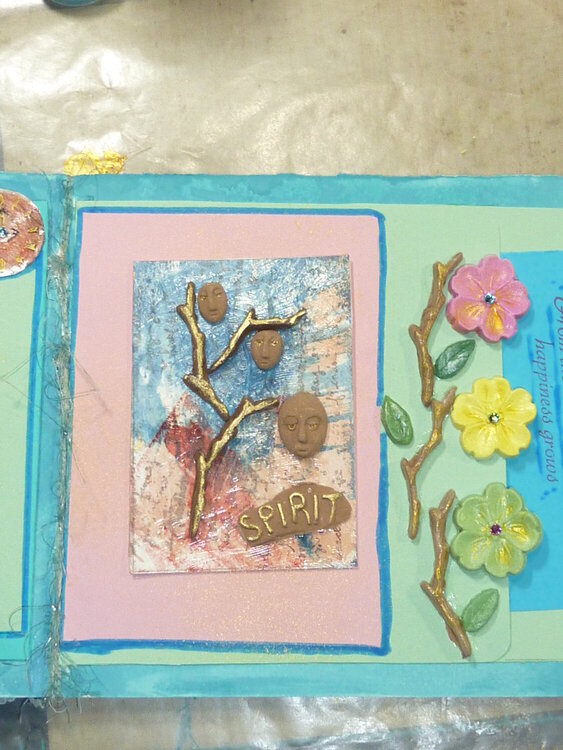 art journal page with air dried clay flowers