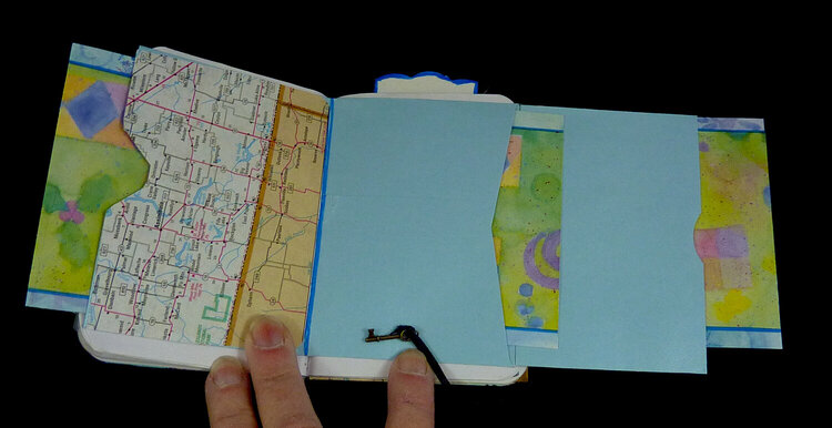 fold outs in an art journal made with a long envelop