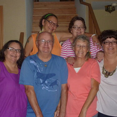 Uncle Fred and Aunt Mary with me and my sisters.