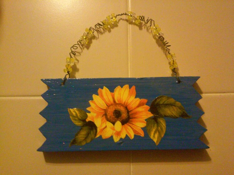 old board i re paintedand put curled wire and added beads
