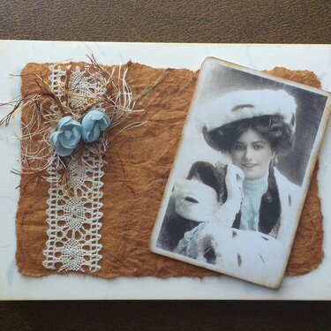 Vintage card oranged-colored brown with pale blue flowers