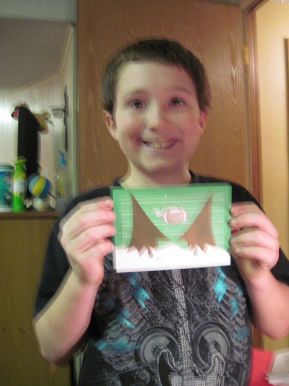 nephew with christmas card he designed with me.