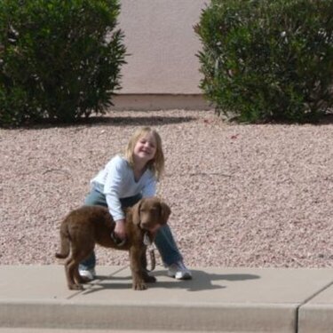 My neice taking my pup for a walk