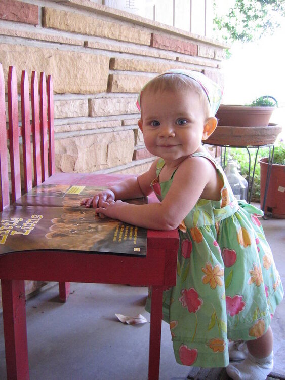 Abigail reading on the front porch
