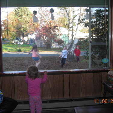 Ashlyn watching the big kids play outside.
