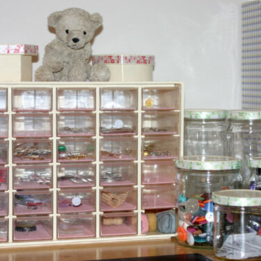 Close up of utility box with drawers and recycled jars