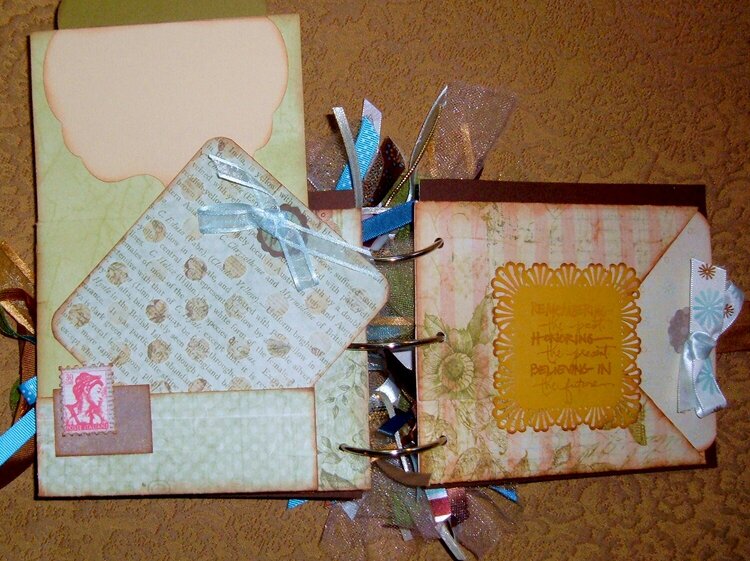 inside mini scrapbook with tags