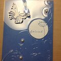 Embossed acetate and adhered to card under pearls, butterfly and sentiment.