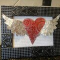 Embossed metal frame and heart