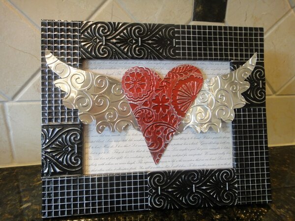 Embossed metal frame and heart