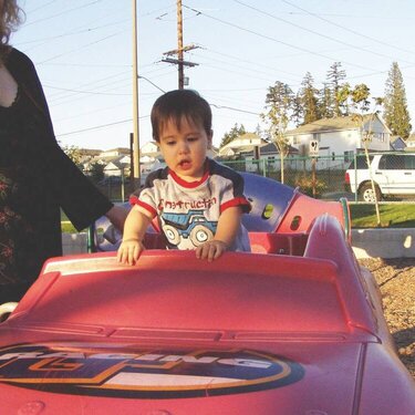 Berkay in the Red Hot Rod at the Playground